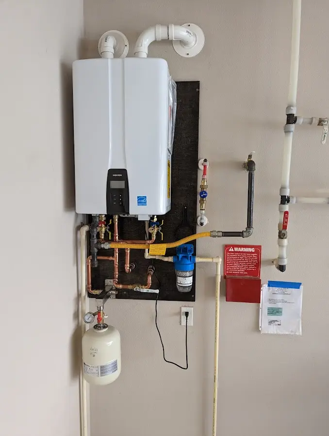 Professional plumber installing copper piping in a Grand Saline home